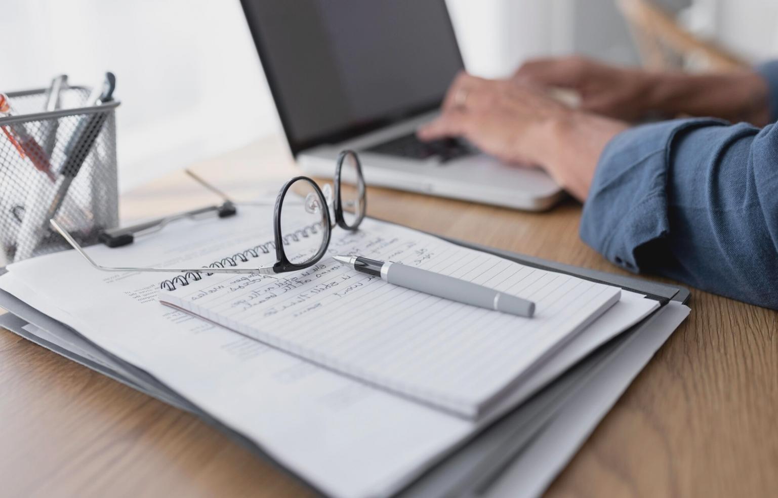 Students working together on financial planning worksheets during group session